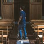 man standing in empty church