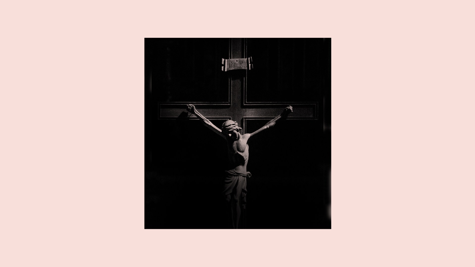 Jesus on the cross fading into shadow
