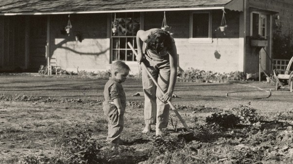 A mom and son gardening.