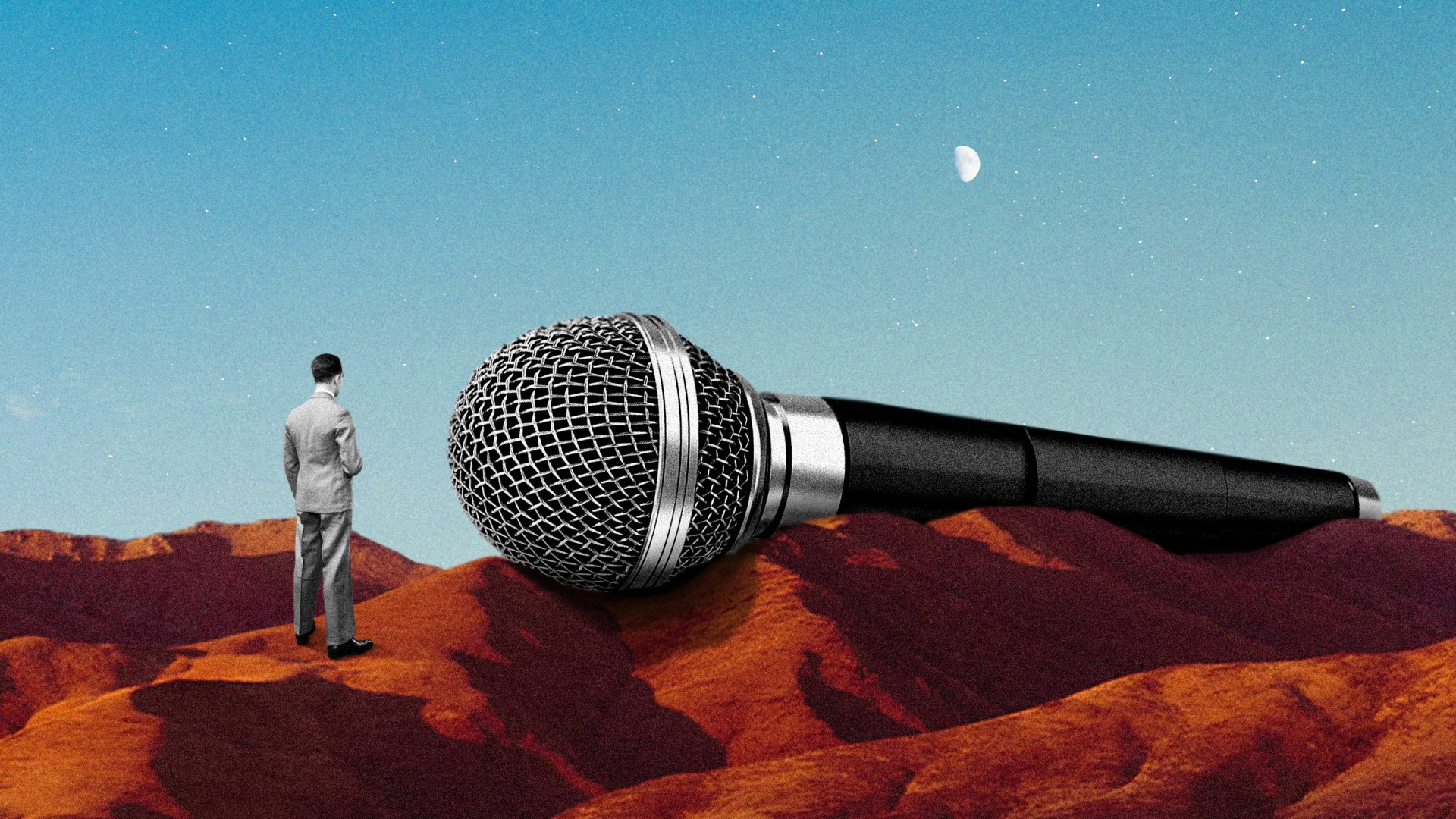 A tiny man next to a huge microphone.