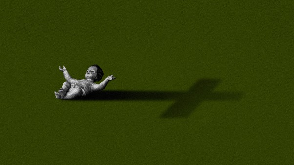 Baby Jesus and a cross shadow.