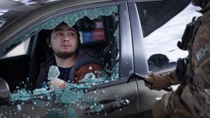 U.S. Border Patrol agents smash a man's car window before dragging him out and taking him into custody when he failed to present citizenship documentation at a gas station on January 11, 2026 in St. Paul, Minnesota.