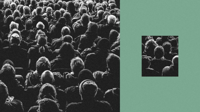 A big group of people separated from a small group of people.